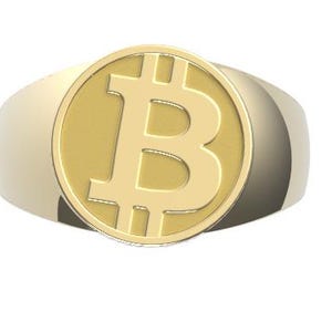 Könnte beinhalten: Ein goldener Ring mit einem großen, runden, goldenen Bitcoin-Symbol auf der Oberseite.