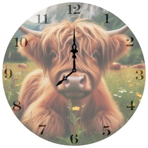 May include: A brown and white Highland cow with long, shaggy hair is lying in a field of green grass and wildflowers. The cow is looking directly at the camera with a friendly expression. The image is a clock face with Roman numeral hour markers.