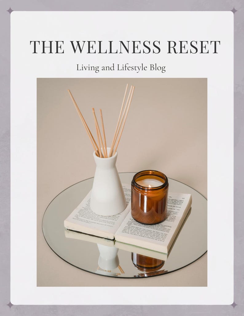 May include: A white ceramic vase with wooden sticks and a brown glass candle on a book and a round mirror. The text "THE WELLNESS RESET" and "Living and Lifestyle Blog" is on the image.