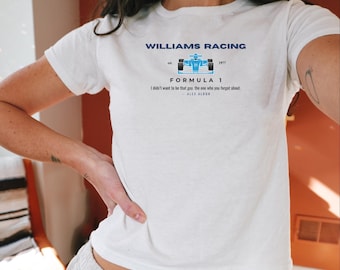 May include: White t-shirt with a blue and white graphic of a race car and the text "WILLIAMS RACING", "FORMULA 1", "I didn't want to be that guy, the one who you forget about." and "ALEX ALBON".