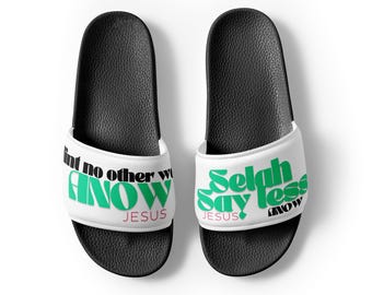 May include: Pair of black slide sandals with white straps. The straps feature the text "aint no other way I KNOW JESUS" and "Selah say less KNOW" in green and white.