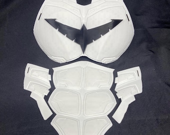 May include: White plastic costume armor for the chest and torso, with a black bat symbol on the chest piece.