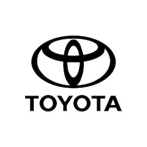 May include: Black and white logo of the Toyota car brand. The logo features a stylized oval with an overlapping circle inside. The word "TOYOTA" is written in all caps below the oval.
