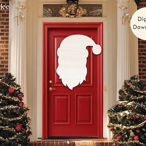 May include: A wooden Santa Claus face cutout is mounted on a red door. The door is framed by white columns and brick. Two Christmas trees flank the door, decorated with lights and ornaments. A digital download graphic is in the upper right.