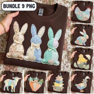 May include: A brown sweatshirt featuring three appliqued bunnies in floral, gingham, and polka dot patterns. The bunnies have cream-colored ears and bows. The image also shows other brown sweatshirts with Easter-themed appliqued designs, including a chicken, a bunny, a chick, a lamb, carrots, gift boxes, and a duck.