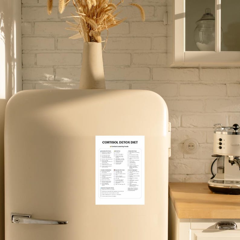 May include: A white refrigerator magnet with a black and white checklist titled "Cortisol Detox Diet" with a list of "Cortisol Lowering Foods".