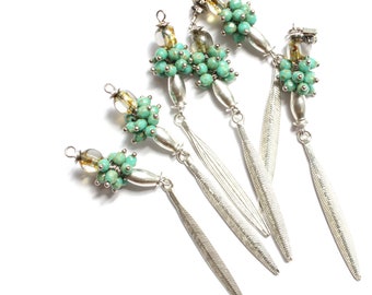 CALARCÁ long leaf shaped earrings with green beads