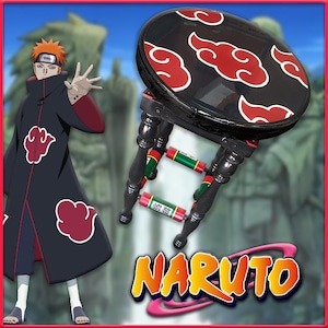 May include: A black wooden stool with red and black cloud designs on the top. The stool has green and red accents on the legs. The word "NARUTO" is written in large letters below the stool.
