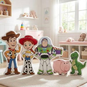 May include: A set of Toy Story character cushions, including Woody, Jessie, Buzz Lightyear, Hamm the Pig, and Rex the Dinosaur. The cushions are displayed in a child's bedroom, with a neutral carpet.