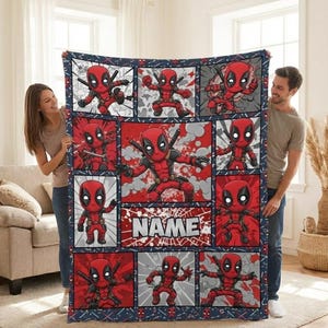 May include: A red and black Deadpool-themed blanket featuring multiple panels with Deadpool illustrations. The blanket has a navy blue border with a comic book style design and the word "NAME" in a white font.