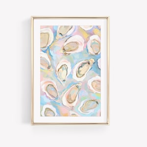 May include: A framed art print with an abstract watercolour painting of oysters. The artwork depicts a pattern of open oyster shells in beige and cream hues, set against a backdrop of pastel blues, pinks, and yellows. The frame is gold.
