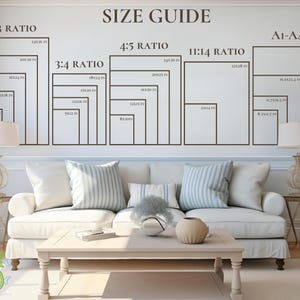 May include: A size guide for picture frames on a wall, showing ratios such as 2:3, 3:4, 4:5, and 11:14, with dimensions in inches. The guide is above a white sofa with striped cushions and a light wood coffee table.