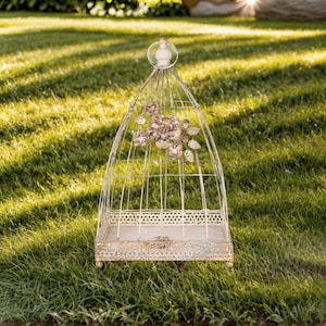 Vintage White Distressed Finish Metal Birdcage with Floral Accents and Elegant Design for Rustic or Shabby Chic Decor