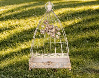 Vintage White Distressed Finish Metal Birdcage with Floral Accents and Elegant Design for Rustic or Shabby Chic Decor