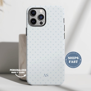 May include: A light blue phone case with a polka dot pattern and the initials "AS". The case has a camera cutout and side buttons. Text on the case says "Personalized Make It Yours" and "Ships Fast".