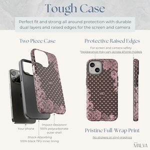 May include: A two-piece phone case featuring a dark brown background with white polka dots and pink lace floral accents. The case includes a black TPU inner lining and a polycarbonate outer shell with the monogram MD. Text includes Tough Case.
