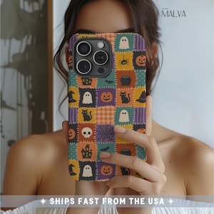 May include: A smartphone case featuring a patchwork design with Halloween-themed illustrations including ghosts, pumpkins, black cats, skulls, spiders, and haunted houses in orange, purple, teal, and yellow. The text MALVA is printed at the top.
