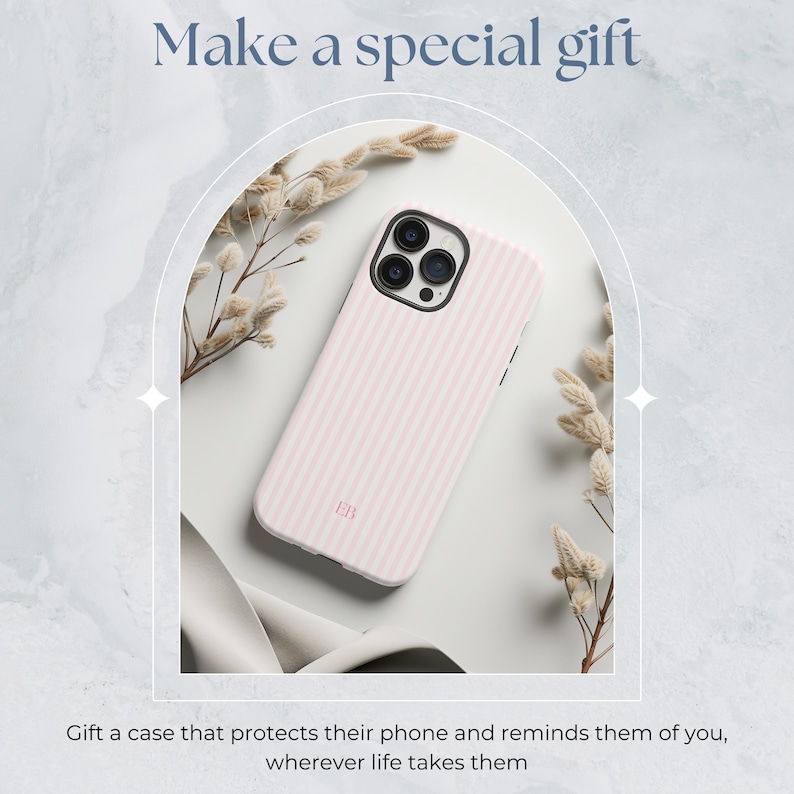 May include: A pink and white striped phone case with a camera lens cutout and the initials "EB" printed on the back.