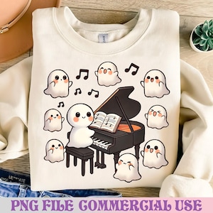 May include: Cream-colored sweatshirt featuring a whimsical design of a ghost playing a black piano, surrounded by musical notes and other friendly ghosts. The text "PNG FILE COMMERCIAL USE" is at the bottom.