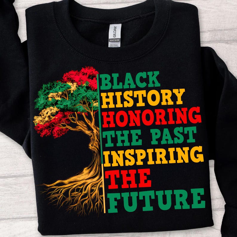 May include: Black sweatshirt with a colorful tree graphic and the text "Black History Honoring The Past Inspiring The Future" in green, yellow, and red. The tree has red, green, and yellow leaves.