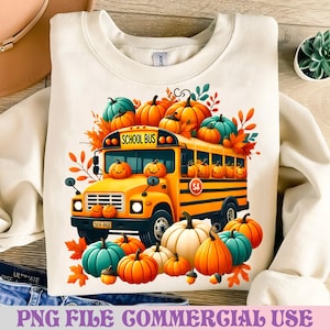 May include: Cream-colored sweatshirt featuring a vibrant illustration of a yellow school bus adorned with smiling pumpkins. Surrounding the bus are orange, white, and teal pumpkins, along with fall foliage. The text "SCHOOL BUS" is visible on the bus. The bottom of the shirt has the text "PNG FILE COMMERCIAL USE".