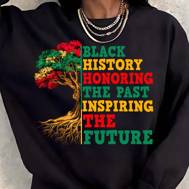 May include: Black sweatshirt with a tree graphic in red, yellow, and green. Text on the right reads "BLACK HISTORY HONORING THE PAST INSPIRING THE FUTURE" in green, red, and yellow.