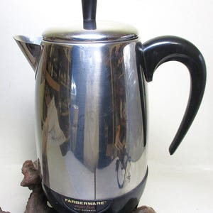 May include: A silver and black Farberware Superfast fully automatic coffee maker. The coffee pot has a black handle and a black base.