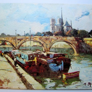 May include: A painting of a stone bridge over a river with a barge docked on the right side of the bridge. The bridge has multiple arches and the river is a light blue color. In the background, a tall church with a pointed spire is visible. The painting is signed "M. Offarty" in the lower right corner.