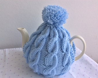 Knitted Tea Cosy cable design in powder blue: fits a 6 cup pot (slightly paler than the picture).