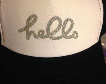 Black, white, and silver Hello trucker hat