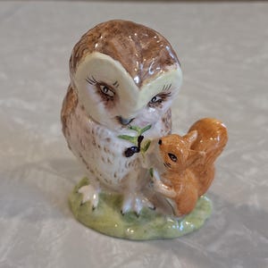 May include: A set of three ceramic mugs with a speckled, matte finish. The mugs are in shades of cream, light gray, and dark gray. Each mug has a simple, minimalist design, perfect for coffee or tea.