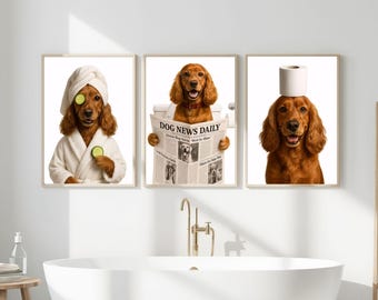 May include: Three framed prints featuring dogs in humorous bathroom scenes. One dog wears a towel and cucumber slices, another reads "Dog News Daily," and the third has a toilet paper roll on its head. The dogs have brown fur.