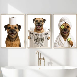May include: Three framed prints featuring dogs in humorous bathroom scenes. One dog has a toilet paper roll on its head, another reads a newspaper, and the third wears a spa robe and cucumber slices on its eyes.