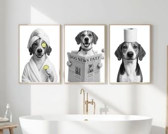 May include: Set of three framed black and white dog art prints. One dog wears a spa towel and cucumber slices, another reads a newspaper, and the third has a toilet paper roll on its head. Bathroom wall decor.