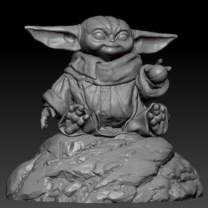 May include: A gray, 3D printed figurine of a character from the Star Wars franchise, known as "The Child" or "Baby Yoda", sitting on a rock. The character is wearing a brown robe and holding a small, round object in its hand.