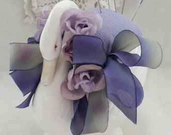 Delicate flower trimmed pincushion in porcelain swan