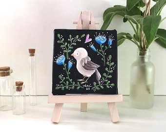 Tiny original decorative painting of a beige bird on black background with floral wreath - Shelf decor small painting of sparrow on easel