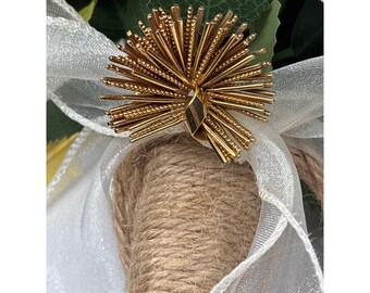 Broche vintage Grosse 61 con forma de estrella dorada y erizo de mar / Marcado