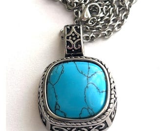 Collar con colgante de turquesa con volutas ornamentadas / Piedra azul cuadrada grande y detalles en plata de ley