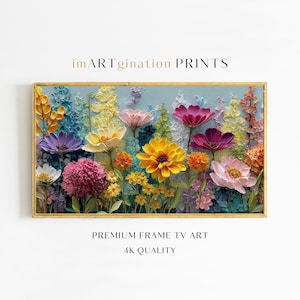May include: A framed floral artwork featuring a vibrant array of colorful flowers in shades of yellow, pink, purple, and orange against a light blue background. The artwork is labeled "imARTgination PRINTS" and "PREMIUM FRAME TV ART 4K QUALITY".