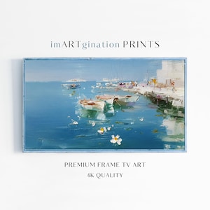 May include: A framed oil painting depicts a serene coastal scene with boats floating on blue water. The artwork features a pier, buildings, and the text "imARTgination PRINTS" and "PREMIUM FRAME TV ART 4K QUALITY".
