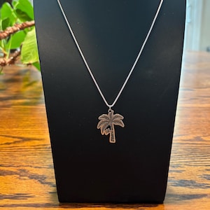 Solid Sterling Silver Person Falling From a Coconut Tree Necklace