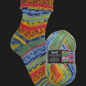 May include: A hand-knitted sock and a ball of yarn featuring a vibrant multicolored pattern of blue, yellow, green, and red. The yarn label reads Opal, 100 g ca. 425 m, 75% Schurwolle 25% Polyamid, In Variation nach Hundertwassers Werk 988 Kuss im Regen.
