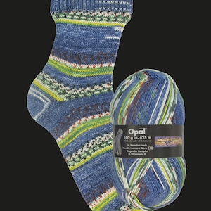 May include: A knitted sock with a blue, green, and white patterned design alongside a ball of matching yarn. The yarn label reads Opal, 100 g, 425 m, 75% Schurwolle, 25% Polyamid, In Variation nach Hundertwassers Werk 150, Singender Dampfer in Ultramarin III.