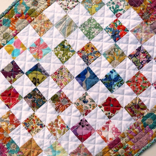 Patchwork doll quilt - made from bright floral Liberty of London tana lawn fabric