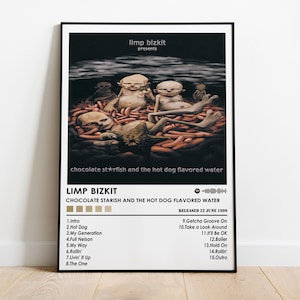May include: A framed poster featuring the album art for Limp Bizkit's "Chocolate Starfish and the Hot Dog Flavored Water." The artwork depicts figures in a dark, surreal setting. The poster includes the album title, band name, and tracklist.