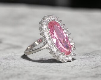Elliptic Rose Quartz Ring: Sterling Silver, Zircon Halo