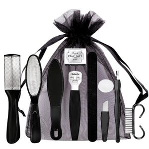 May include: A black pedicure set containing a range of tools, such as a foot file, nail file, and blade, presented in a black mesh drawstring bag. The kit includes a foot rasp, a callus shaver, and a nail brush.