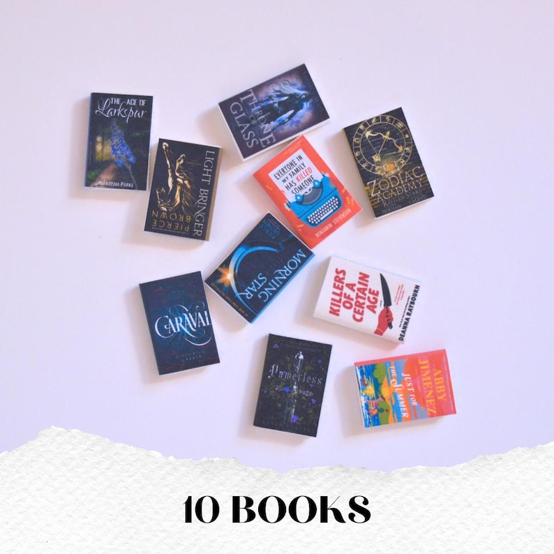 May include: Ten miniature books with colorful covers are arranged on a white surface. Titles include "Larkspur," "Throne of Glass," "Light Bringer," "Morning Star," and "Killers of a Certain Age." The text "10 BOOKS" is at the bottom.