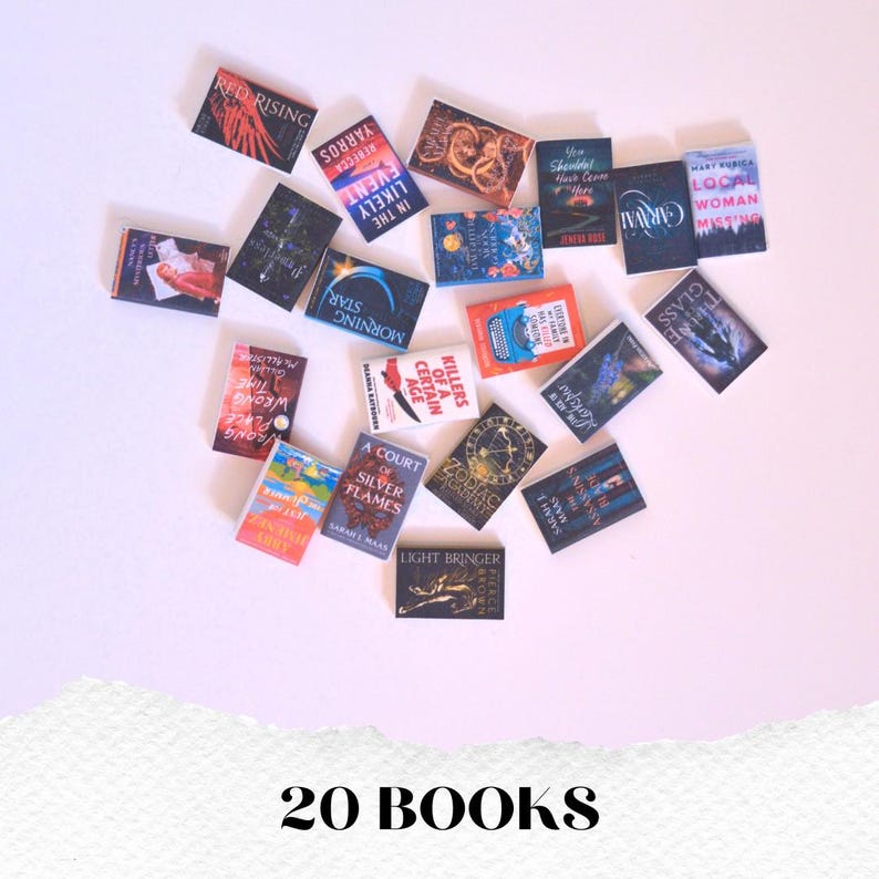 May include: A collection of twenty miniature books with various titles and colorful covers. The books are arranged on a white surface, with titles like "Red Rising," "Caraval," and "A Court of Silver Flames" visible. The text "20 BOOKS" is at the bottom.